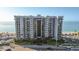 Stunning beachfront condo building with multiple balconies and ocean views near a pool and beach at 1660 Gulf Blvd # Ph2, Clearwater Beach, FL 33767