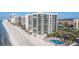 An expansive condo building on a white sand beach with an outdoor swimming pool at 1660 Gulf Blvd # Ph2, Clearwater Beach, FL 33767