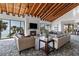 Spacious living room with a fireplace, ocean views, and comfortable seating at 1660 Gulf Blvd # Ph2, Clearwater Beach, FL 33767