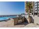 Grilling area next to a luxurious pool with clear ocean views at 1660 Gulf Blvd # Ph2, Clearwater Beach, FL 33767
