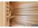 Interior view of sauna featuring cedar plank walls, benches, and electric heater at 1660 Gulf Blvd # Ph2, Clearwater Beach, FL 33767