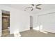 Bright bedroom with fan, closet and ensuite bathroom with tiled shower at 1740 Coco Palm Cir, Sun City Center, FL 33573