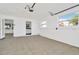 Clean garage space with tile floors, natural light, and interior access door at 1740 Coco Palm Cir, Sun City Center, FL 33573