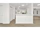 Modern, white kitchen with stainless steel appliances and sleek countertops, perfect for cooking and entertaining at 1740 Coco Palm Cir, Sun City Center, FL 33573