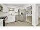 Bright kitchen featuring stainless steel appliances, granite countertops, and hardwood flooring at 1740 Coco Palm Cir, Sun City Center, FL 33573