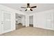 Bright living room featuring tile floors, fresh white paint, and a ceiling fan at 1740 Coco Palm Cir, Sun City Center, FL 33573