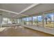Light-filled sunroom featuring tiled floors and an abundance of windows with outdoor views at 1740 Coco Palm Cir, Sun City Center, FL 33573