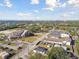 Aerial view of a sunny neighborhood featuring a church, school, and diverse buildings at 1741 S Martin Luther King Jr Ave, Clearwater, FL 33756