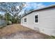 The backyard shows the property's side and its landscaping potential at 1931 24Th S St, St Petersburg, FL 33712