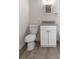 Bathroom featuring a granite countertop and wood-look floors at 1931 24Th S St, St Petersburg, FL 33712