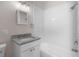 Bathroom featuring a granite countertop and white subway tile in the shower/tub combo at 1931 24Th S St, St Petersburg, FL 33712