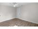 Neutral bedroom featuring wood-look floors and a white ceiling fan at 1931 24Th S St, St Petersburg, FL 33712