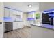 Modern kitchen with white cabinets, granite counters, and stainless steel appliances at 1931 24Th S St, St Petersburg, FL 33712