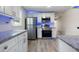 Updated kitchen featuring white cabinets, granite counters, and stainless appliances at 1931 24Th S St, St Petersburg, FL 33712