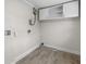 A well-lit laundry area includes storage cabinets and utility connections at 1931 24Th S St, St Petersburg, FL 33712