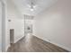 Neutral room featuring wood-look floors and a white ceiling fan at 1931 24Th S St, St Petersburg, FL 33712