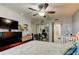 A calming bedroom featuring a ceiling fan, spacious layout, and a crib for a -friendly space at 200 Country Club Dr # 503, Largo, FL 33771