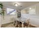 Bright dining area featuring wainscoting and laminate flooring at 200 Country Club Dr # 503, Largo, FL 33771