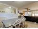 Dining room with seating for four and open access to the living room at 200 Country Club Dr # 503, Largo, FL 33771