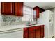 The kitchen boasts updated wood cabinets, granite countertops, and stainless steel appliances at 200 Country Club Dr # 503, Largo, FL 33771