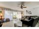 Comfortable living room with ceiling fan and sliding glass doors to the porch at 200 Country Club Dr # 503, Largo, FL 33771