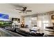 Inviting living room featuring a ceiling fan, modern furniture, and bright natural light at 200 Country Club Dr # 503, Largo, FL 33771
