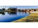 Community pond with fountain and walking bridge offers residents scenic views at 200 Country Club Dr # 503, Largo, FL 33771