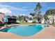 Beautiful backyard with a refreshing pool and screened-in patio, perfect for outdoor enjoyment at 2012 Cricket Ln, Valrico, FL 33594