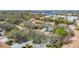 A high angle shot shows a beautiful pool near these gorgeous villas with a lakeside view at 2606 Oak Cir, Tarpon Springs, FL 34689