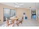 Light and airy dining room with a ceiling fan and large window at 3118 Eagles Landing W Cir, Clearwater, FL 33761