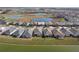 Community view featuring single-Gathering homes, serene ponds, and well-maintained landscaping, creating a peaceful residential setting at 31675 Cannon Rush Dr, San Antonio, FL 33576