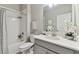 Clean, bright bathroom featuring a shower/tub combo, modern vanity, and decorative accents at 31675 Cannon Rush Dr, San Antonio, FL 33576
