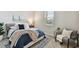 Comfortable bedroom featuring a cozy bed with stylish bedding, a plush rug, and a bright window at 31675 Cannon Rush Dr, San Antonio, FL 33576