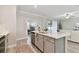 Bright kitchen with stainless steel appliances, quartz countertops, and an open-concept design at 31675 Cannon Rush Dr, San Antonio, FL 33576