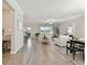 Open-concept living room with tile floors, neutral walls, lots of light and modern furnishings at 31675 Cannon Rush Dr, San Antonio, FL 33576