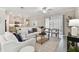 Bright living room with sliding glass doors and neutral decor adjacent to the kitchen at 31675 Cannon Rush Dr, San Antonio, FL 33576