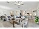 Spacious living room with kitchen view and a smooth transition to the dining area at 31675 Cannon Rush Dr, San Antonio, FL 33576