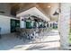 Chic outdoor bar featuring ample seating, stylish lighting, and a relaxed ambiance for socializing and entertaining at 31675 Cannon Rush Dr, San Antonio, FL 33576