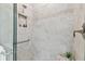 Stylish shower with gray tiling, a built-in niche, and sleek fixtures at 31675 Cannon Rush Dr, San Antonio, FL 33576