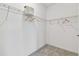 Empty walk-in closet with carpet, white walls and wire shelving at 31675 Cannon Rush Dr, San Antonio, FL 33576