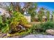 Lush backyard pond with waterfall and ample vegetation creates a backyard oasis at 3933 60Th N St, St Petersburg, FL 33709