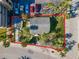 Overhead view of a property featuring a fenced yard and trees on a sunny day at 40 140Th E Ave, Madeira Beach, FL 33708