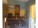 Bathroom with a large vanity, granite countertop and cabinets needing TLC at 4004 27Th Se St, Ruskin, FL 33570