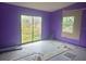 Bedroom needing TLC, with window and sliding glass door to backyard at 4004 27Th Se St, Ruskin, FL 33570