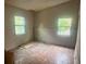 Bedroom with two windows and drywall incomplete, ready for customization at 4004 27Th Se St, Ruskin, FL 33570