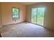 Bedroom with a large sliding glass door to the yard, awaiting completion at 4004 27Th Se St, Ruskin, FL 33570