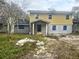 Two-story home with a covered entry and partially completed exterior at 4004 27Th Se St, Ruskin, FL 33570
