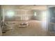 Large living room with unfinished drywall and visible window frames awaiting updates at 4004 27Th Se St, Ruskin, FL 33570