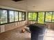 Bright sunroom with large windows showcasing the natural outdoor view and tile floor at 4004 27Th Se St, Ruskin, FL 33570