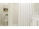 Bright bathroom with shower, tub, white tile, and updated fixtures at 4006 Northern Key Dr, Plant City, FL 33563